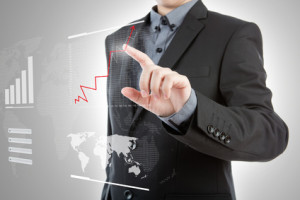 Business man pressing high tech type of modern graph on a virtua